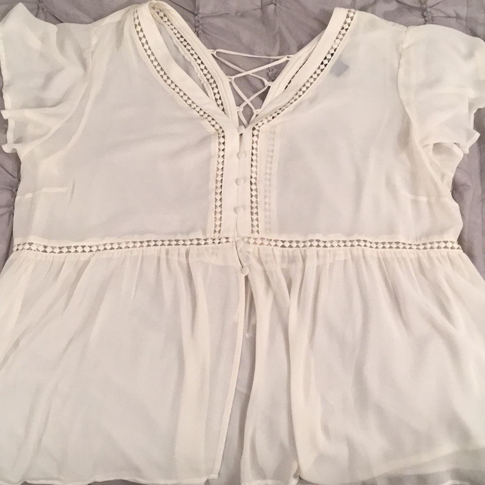 Cream colored sheer blouse